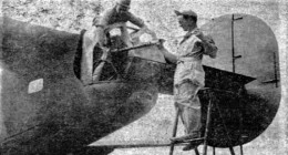 Flight Engineer SSgt. Charles D. Ginn cleaning gun