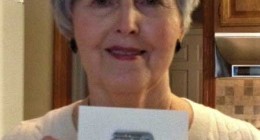 Betty Brown with personnel ID tag of Gunner SSgt. Harry D. Tucker