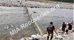 Clayton preparing to cross<br /> seasonal bridge on Dihing River