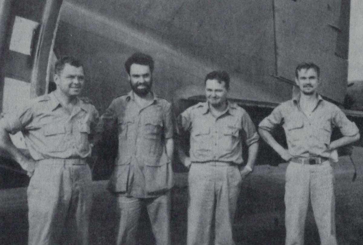 Pilot Capt. C. Joseph Rosbert (2nd from L.) and Co-Pilot Charles R. Hammell (R.) after return to US control in India - 1943