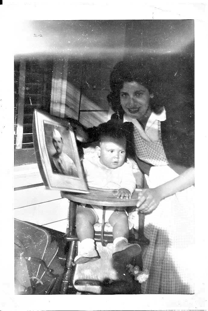 Lt. Scherer's wife Santina with son Bill  holding photo of Lt. Scherer