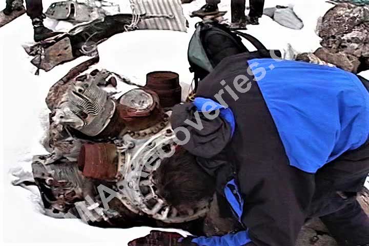 Clayton examining wreckage