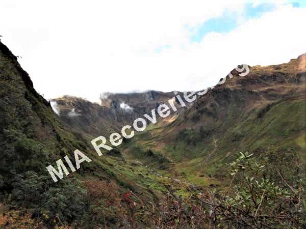 Crash site on green slope in rear-center