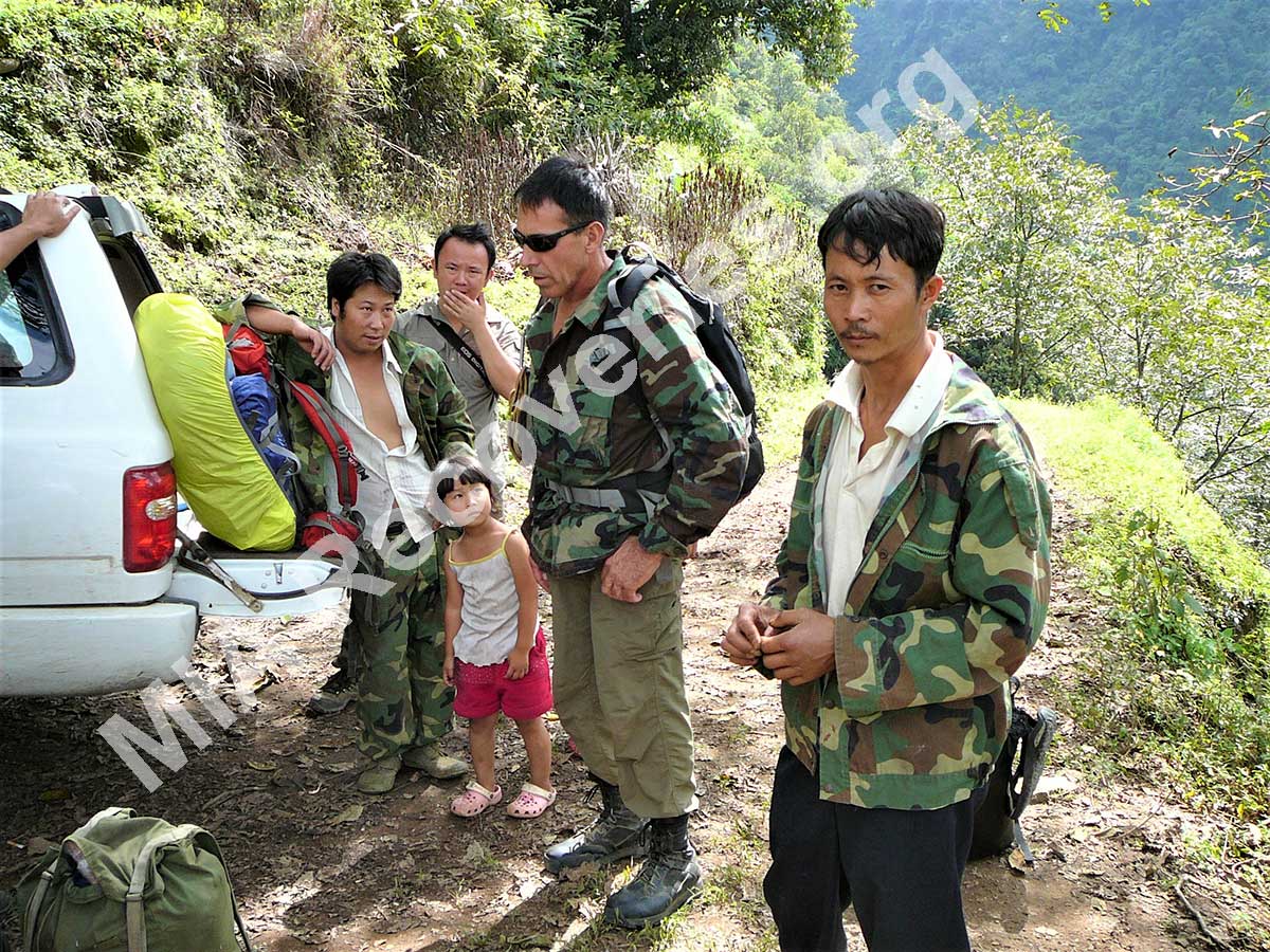 Local villagers, Clayton and guide at roadhead