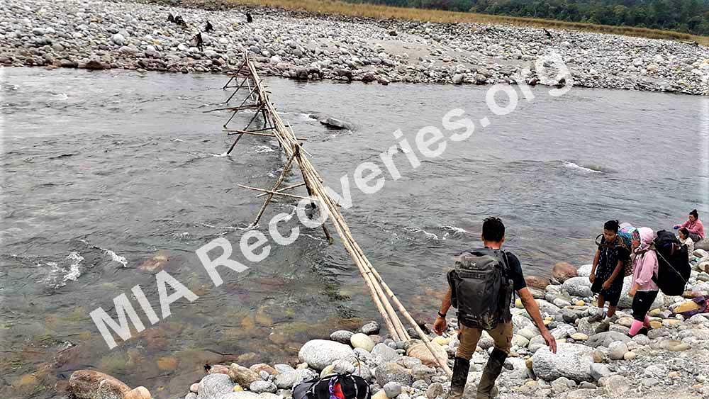 Clayton preparing to cross<br /> seasonal bridge on Dihing River