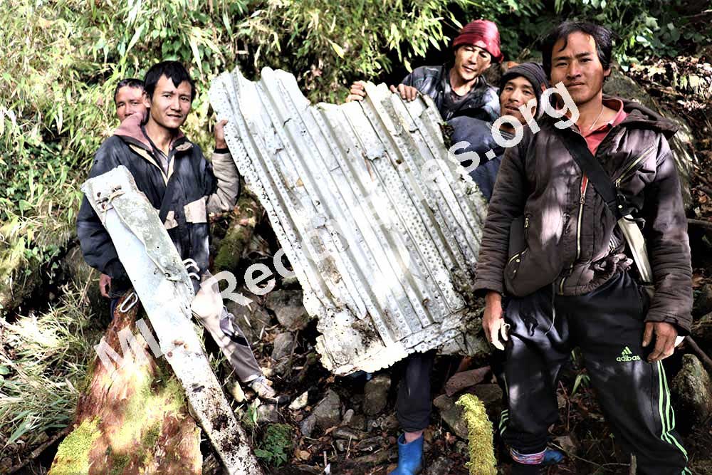 Porters and guide by wreckage